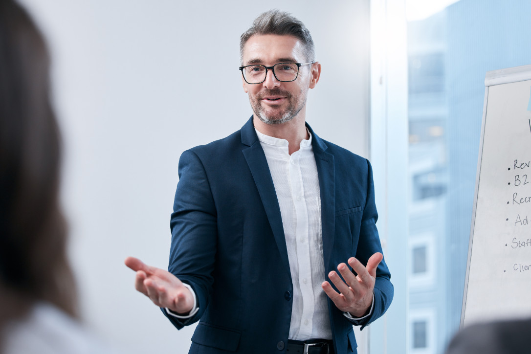 The idea you just mentioned sounds brilliant. Shot of a mature businessman giving a presentation to his colleagues in an office.