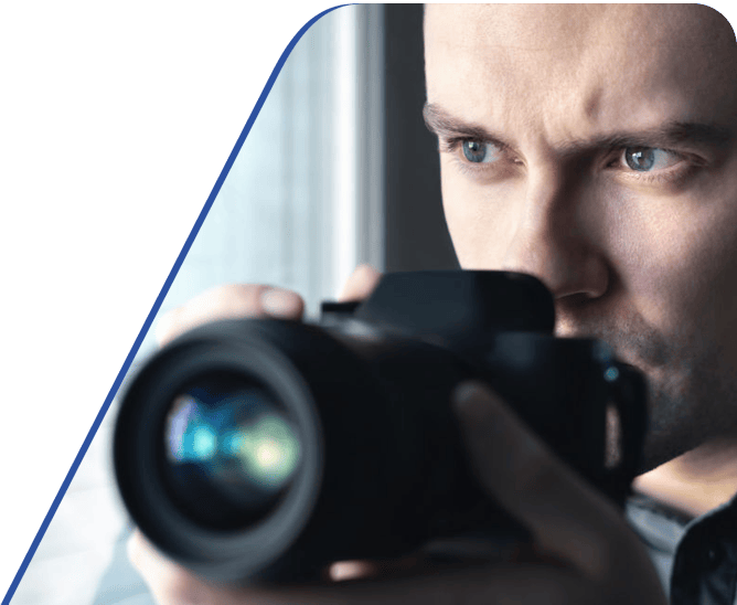 Amtivo (Formerly Certification Europe and EQA) - Private Investigator Certification - Close-up of a investigator holding a camera