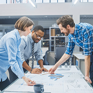 Amtivo (Formerly Certification Europe and EQA) - ISO 45001 Implementation Training - Three people around a desk taking part in training