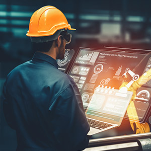 Amtivo (Formerly Certification Europe and EQA) - ISO 50001 Transport Energy Champion Training - A learner in a hardhat looking at data on a computer screen