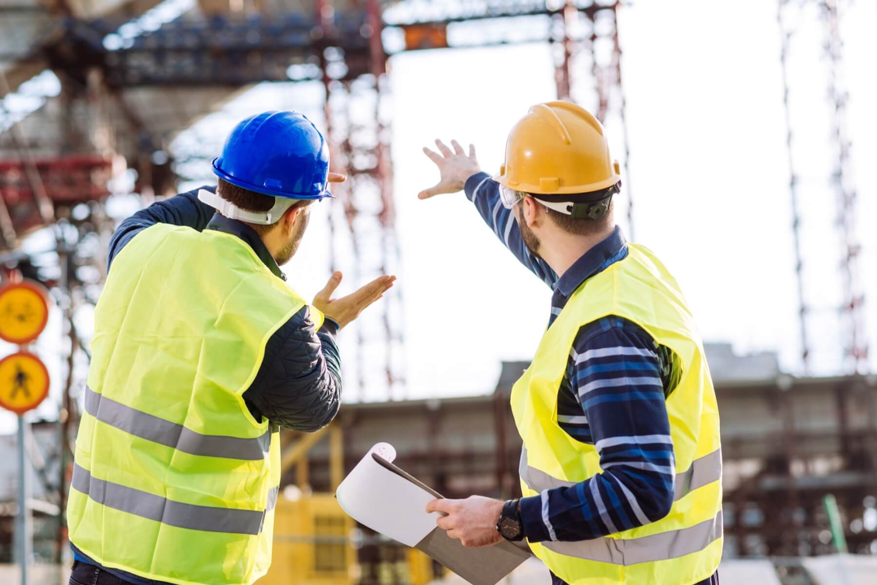 Two construction workers in discussion
